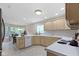 Spacious kitchen features white appliances and neutral colored cabinetry at 9175 Lakewind Dr, Indianapolis, IN 46256