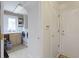 Hallway view of the laundry room featuring a window and utility sink at 9175 Lakewind Dr, Indianapolis, IN 46256