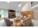 Bright living room with skylights, vaulted ceilings, fireplace, and ample seating at 9175 Lakewind Dr, Indianapolis, IN 46256