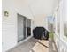 Covered patio with tiled flooring and a grill, perfect for outdoor cooking and relaxation at 9635 Shasta Dr, Fishers, IN 46038