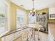 Cozy kitchen nook with a built-in bench, a round table, and bright windows offering natural light at 9635 Shasta Dr, Fishers, IN 46038
