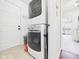 Laundry area featuring a stacked washer and dryer in a neutral colored room at 9635 Shasta Dr, Fishers, IN 46038