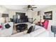 Beautiful living room featuring comfortable seating, a ceiling fan, and an entertainment center, perfect for relaxing and entertaining at 9635 Shasta Dr, Fishers, IN 46038