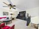 Spacious living room with a ceiling fan, a large entertainment center, and comfortable seating for Gathering and guests at 9635 Shasta Dr, Fishers, IN 46038
