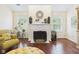 Cozy living room featuring a classic fireplace with decorative accents, creating a warm and inviting atmosphere at 9635 Shasta Dr, Fishers, IN 46038