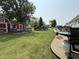 Spacious backyard with a pool, shed, and green grass, perfect for outdoor activities at 106 9Th St, New Market, IN 47965