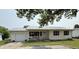 Charming single-story home featuring a metal roof, light siding, and a cozy front porch at 106 9Th St, New Market, IN 47965