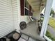 Inviting front porch with red shutters and plenty of space to relax at 106 9Th St, New Market, IN 47965