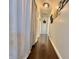Long hallway with gleaming hardwood floors and recessed ceiling lighting at 106 9Th St, New Market, IN 47965