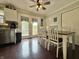 Bright eat-in kitchen with stainless appliances, wooden floors, and french doors at 106 9Th St, New Market, IN 47965