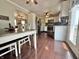 Well-lit eat-in kitchen boasts stainless appliances and wood flooring at 106 9Th St, New Market, IN 47965