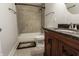 Updated bathroom with tiled shower, vanity with granite counters, and essential fixtures at 110 Highland Ave, Franklin, IN 46131