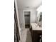 This bathroom has a single sink vanity, toilet and a modern shower with marble surround at 110 Highland Ave, Franklin, IN 46131