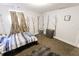 Bedroom features a plush rug, natural light, and calming decor with artistic wall accents at 110 Highland Ave, Franklin, IN 46131