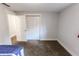 This bedroom features neutral walls, plush carpet and a large closet with a folding door at 110 Highland Ave, Franklin, IN 46131
