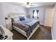 This primary bedroom features neutral walls, plush carpet, a ceiling fan and a window at 110 Highland Ave, Franklin, IN 46131