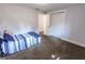 This bedroom features neutral walls, plush carpet and a large closet with a folding door and a bed at 110 Highland Ave, Franklin, IN 46131