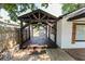 View of the covered deck with stained wood floor at 110 Highland Ave, Franklin, IN 46131