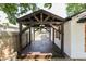 View of covered deck with stained wood floor at 110 Highland Ave, Franklin, IN 46131