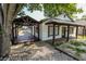 Charming home featuring a covered front porch, wooden deck, and exterior with stone accents at 110 Highland Ave, Franklin, IN 46131