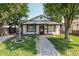 Charming single-story home with a gravel path and lush green lawn, framed by mature trees at 110 Highland Ave, Franklin, IN 46131