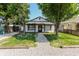 Charming single-story home with a gravel path and lush green lawn, framed by mature trees at 110 Highland Ave, Franklin, IN 46131