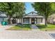 Charming single-story home with covered parking and a gravel driveway lined with timber at 110 Highland Ave, Franklin, IN 46131