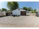 View of a detached one-car garage with a gravel driveway and neutral paint at 110 Highland Ave, Franklin, IN 46131