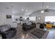 Open concept living space with eat-in kitchen and island featuring modern finishes and wood-look floors at 110 Highland Ave, Franklin, IN 46131