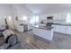 Open-concept living space with kitchen island, stainless appliances, and seamless flow for entertaining at 110 Highland Ave, Franklin, IN 46131