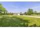 Well-maintained home with a long driveway, lush green lawn, and mature trees, providing ample space at 1114 E 234Th St, Sheridan, IN 46069
