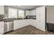 Stylish kitchen with white cabinetry, stainless steel appliances, and dark countertops at 1114 E 234Th St, Sheridan, IN 46069