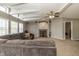Bright living room with a large sofa, decorative fireplace, and unique vaulted ceiling at 1114 E 234Th St, Sheridan, IN 46069