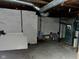 Unfinished basement showing ductwork, white walls, and concrete floor at 1141 N Shadeland Ave, Indianapolis, IN 46219