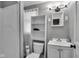 Bathroom with a vanity, toilet, and walk-in shower at 1141 N Shadeland Ave, Indianapolis, IN 46219