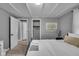 Comfortable bedroom with cozy decor, a closet, and a view into another room at 1141 N Shadeland Ave, Indianapolis, IN 46219