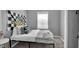 Bedroom featuring checkered decor, comfortable bedding, and natural light from the window at 1141 N Shadeland Ave, Indianapolis, IN 46219