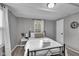 Charming bedroom with a black bed frame, fresh white linens, and a neutral color scheme at 1141 N Shadeland Ave, Indianapolis, IN 46219