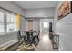Living space features a dining table, a window for natural light, and access to the kitchen at 1141 N Shadeland Ave, Indianapolis, IN 46219