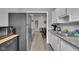 Kitchen featuring stainless steel appliances and a view into a living area at 1141 N Shadeland Ave, Indianapolis, IN 46219