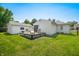 Spacious backyard with a wooden deck, outdoor seating, and lush green lawn perfect for entertaining at 120 Hoss Rd, Indianapolis, IN 46217