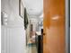 Hallway bathroom features beadboard accent, tile floors and oak vanity at 120 Hoss Rd, Indianapolis, IN 46217