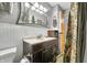 Bathroom featuring a modern vanity, toilet, and an open doorway at 120 Hoss Rd, Indianapolis, IN 46217