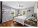 Bright bedroom with hardwood floors, ceiling fan, and ample natural light at 120 Hoss Rd, Indianapolis, IN 46217