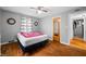 Bedroom features hardwood floors, ceiling fan, and neutral paint at 120 Hoss Rd, Indianapolis, IN 46217