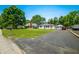 Wide view of a well-maintained home, lawn, driveway, and detached garage at 120 Hoss Rd, Indianapolis, IN 46217
