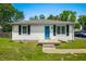 Charming ranch home with a well-maintained lawn, blue front door, and classic curb appeal at 120 Hoss Rd, Indianapolis, IN 46217