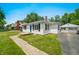 Charming single-story home with white siding, black shutters, and a well-manicured front yard at 120 Hoss Rd, Indianapolis, IN 46217