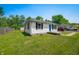 View of house from yard, showing landscaping, hardscape, and the home's exterior at 120 Hoss Rd, Indianapolis, IN 46217