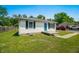 Home's exterior view includes the front door, windows, and partial front yard at 120 Hoss Rd, Indianapolis, IN 46217
